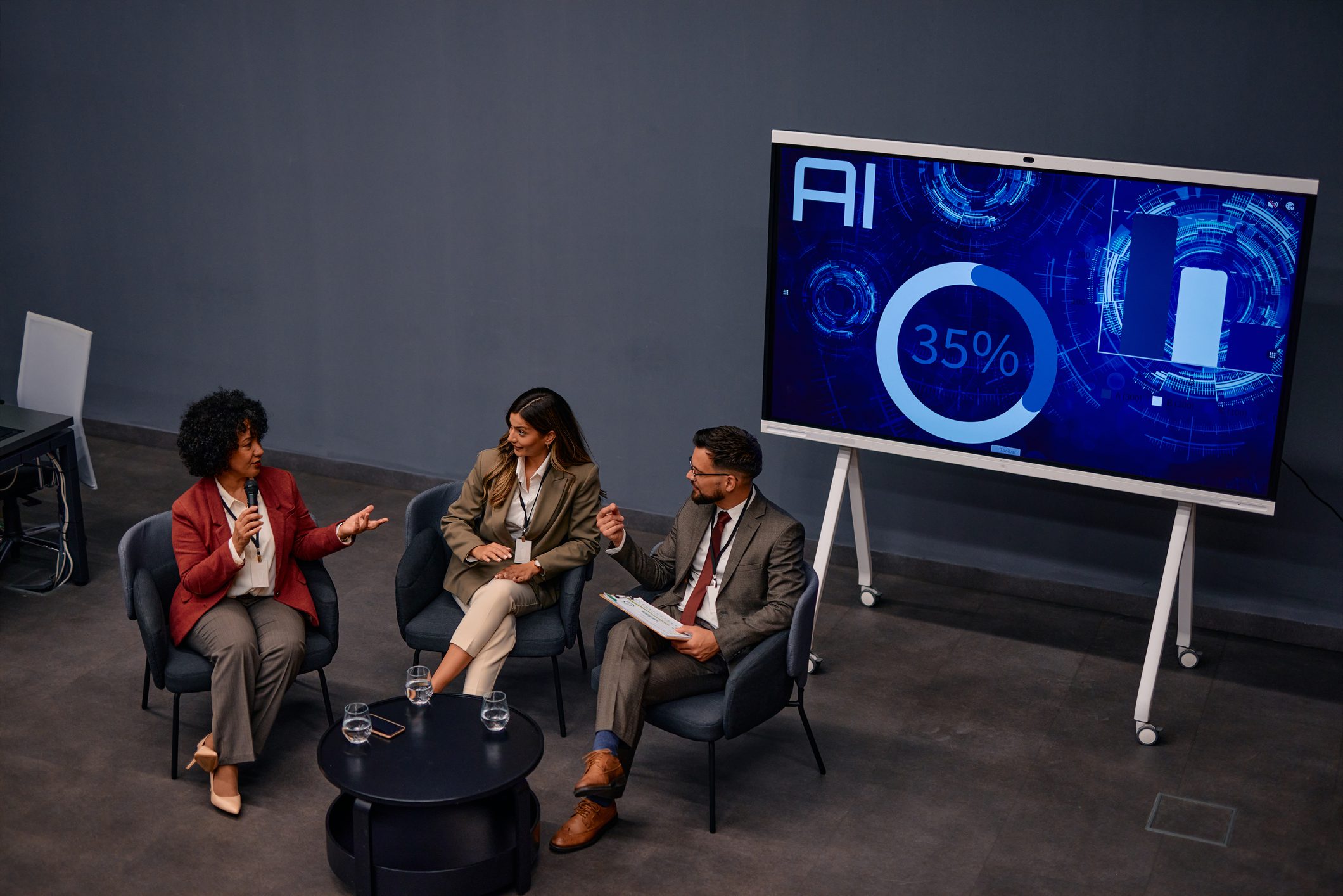 Business meeting with AI statistics displayed
