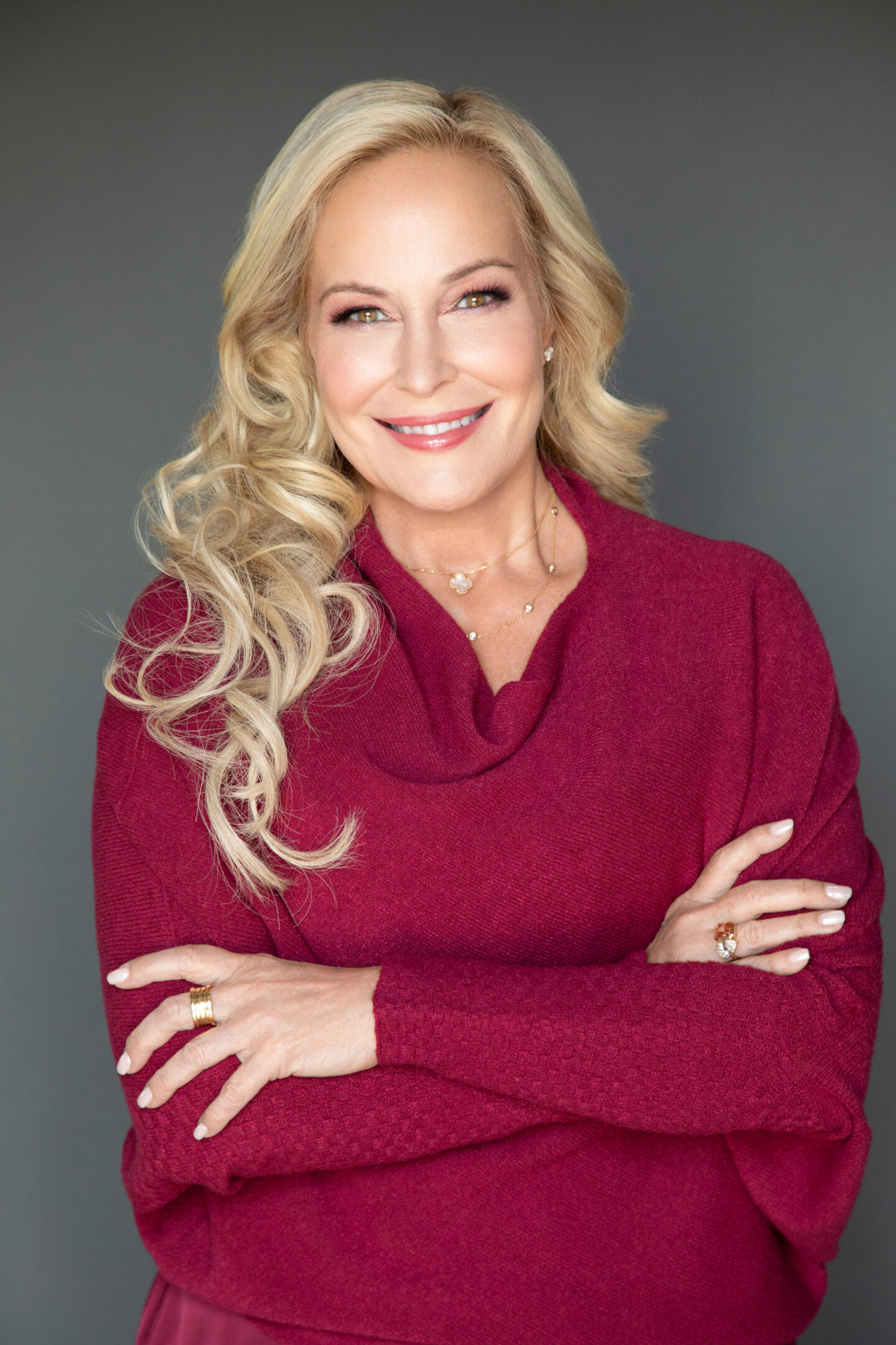 Smiling woman in a red sweater.